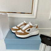 PRADA 25S THICK SOLE SNEAKER IN WHITE AND BROWN CALFSKIN
