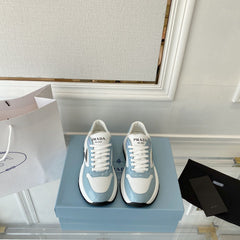 PRADA 25S THICK SOLE SNEAKER IN WHITE AND LIGHT BLUE CALFSKIN