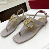THONG SANDALS IN THISTLE PURPLE CALFSKIN WITH GOLD LOGO