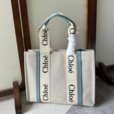 LAGRE WOODY TOTE BAG 45 IN BEIGE LINEN CANVAS BLACK WEBBING LOGO EMBROIDER BLUE CALFSKIN
