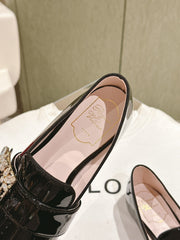 MINI BROCHE VIVIER BUCKLE LOAFERS IN BLACK PATENT CALFSKIN