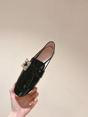 MINI BROCHE VIVIER BUCKLE LOAFERS IN BLACK PATENT CALFSKIN