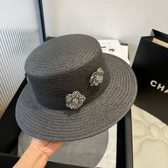 FLAT STRAW HAT BLACK FLOWER ATTACHMENT 673929