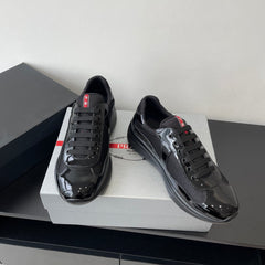 PRADA SNEAKER 25S IN BLACK MESH AND PATENT CALFSKIN