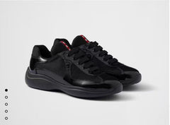 PRADA SNEAKER 25S IN BLACK MESH AND PATENT CALFSKIN