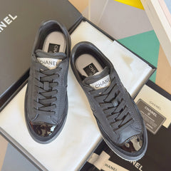 CHANEL 25S SNEAKERS WITH PATENT TOE 20MM IN BLACK CALFSKIN