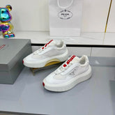 PRADA 25S CROSS LACED SNEAKERS IN WHITE CALFSKIN