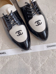 CHANEL 25S TWO TONE LACE UP IN BLACK AND WHITE SHINY CALFSKIN