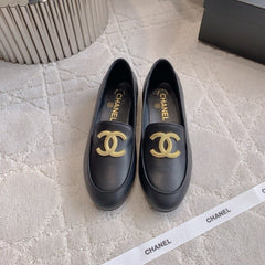 CHANEL 25S LOAFERS WITH LARGE LOGO IN BLACK CALFSKIN GOLD HARDWARE