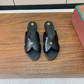 FLAT SLIPPERS IN BLACK CALFSKIN