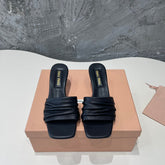 HIGH - HEEL BLACK SHEEPSKIN WITH STYLIZED STRAPS