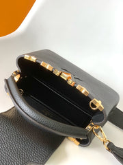 CAPUCINES MM BAG 21 IN BLACK TAURILLON COWHIDE GOLD HARDWARE