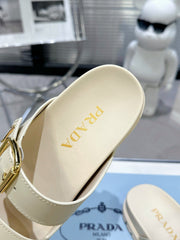 PRADA 25S STRAP SLIDES 30MM IN CREAM CALFSKIN GOLD HARDWARE