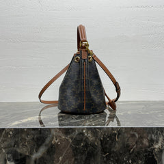 CLARA BAG 19 IN BLACK TRIOMPHE CANVAS AND BROWN CALFSKIN TRIM