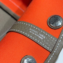 GARDEN PARTY 30CM IN ORANGE MINIMUM TOILETS COTTON CANVAS AND BROWN CALFSKIN