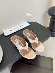 ALAIA WEDGE THONG SANDALS 25S IN BLUSH BEIGE SATIN
