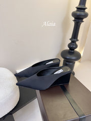 ALAIA HIGH MULES 25S IN BLACK SATIN