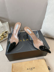 ALAIA HIGH MULES IN BLACK PATENT CALFSKIN AND FILM