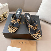 ALAIA HEELED THONG 25S 55 MM IN LEOPARD PONY HAIR LEATHER