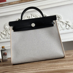 ZIP CABINE 31 BAG IN PALE GRAY CANVAS AND BLACK CALFSKIN