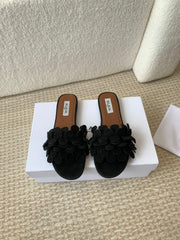 ALAIA FLAT MULE IN BLACK SUEDE