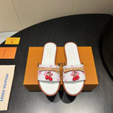 LV SLIDE SANDALS 25S IN WHITE CALFSKIN WITH CHERRY BLOSSOM BUCKLE