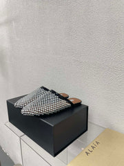 ALAIA FLAT MULES IN STRASS BLACK LAMBSKIN WITH RHINSTONES