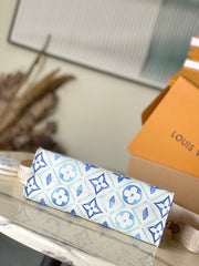 ONTHEGO EAST WEST 25 IN LAGOON BLUE MONOGRAM TILES CANVAS