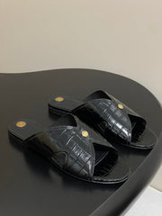 FLAT SLIPPERS IN BLACK CALFSKIN SNAKE EMBOSSING