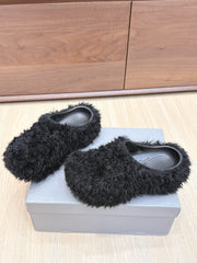BALENCIAGA 25S MULES IN BLACK FAUX FUR