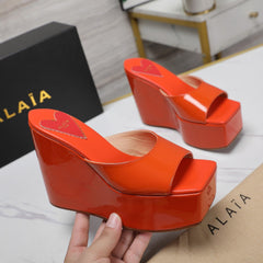 ALAIA PLATFORM WEDGE IN VIVID ORANGE LAMBSKIN WITH RED HEART