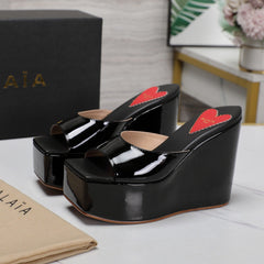 ALAIA PLATFORM WEDGE IN BLACK LAMBSKIN WITH RED HEART