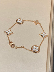 STAR AND SUN 5 MOTIF MOP PINK GOLD BRACELET
