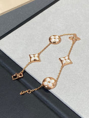 STAR AND SUN 5 MOTIF MOP PINK GOLD BRACELET