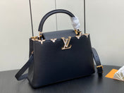 CAPUCINES MM 31 BLACK TAURILLON GOLD HARDWARE