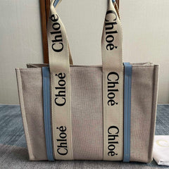 MEDIUM STRAP WOODY TOTE BAG 37 IN BEIGE LINEN CANVAS BLACK WEBBING LOGO EMBROIDER BLUE CALFSKIN