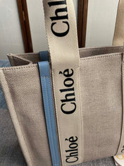 MEDIUM STRAP WOODY TOTE BAG 37 IN BEIGE LINEN CANVAS BLACK WEBBING LOGO EMBROIDER BLUE CALFSKIN