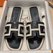 0RAN SANDALS IN BLACK CALFSKIN AND WHITE CANVAS