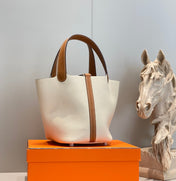 HERMES 25S PICOTIN LOCK 18 IN BURNT ORANGE AND IVORY CALFSKIN SILVER HARDWARE