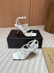 ALAIA THREE-STRAPS HIGH HEEL SANDALS IN WHITE PATENT LAMBSKIN