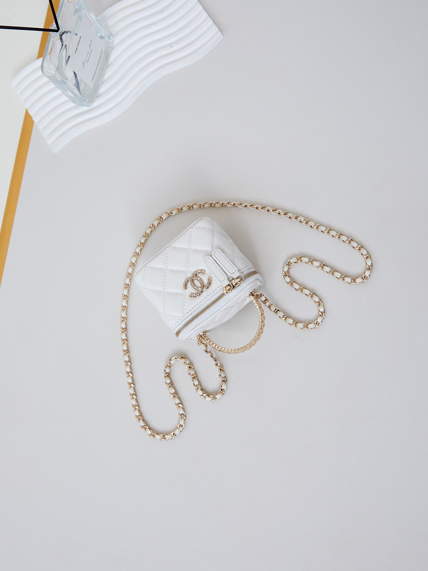 CHANEL 25S MINI VANITY BAG 11 CM IN WHITE LAMBSKIN WITH CRYSTAL-EMBELLISHED CC LOGO