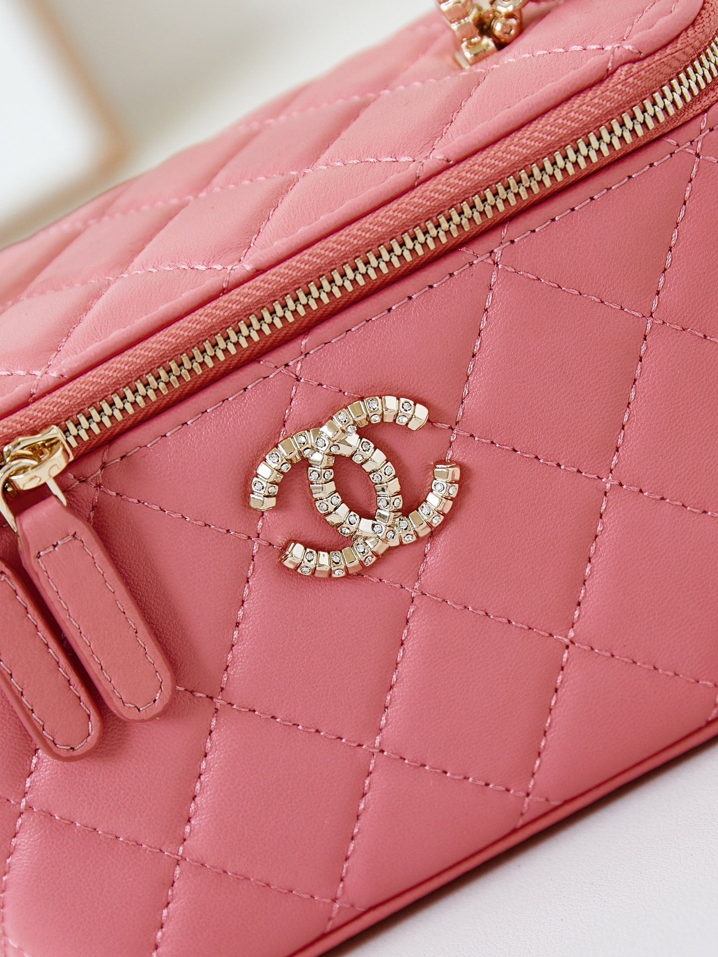 CHANEL 25S MINI VANITY BAG 16 CM IN PEACHY PINK LAMBSKIN WITH CRYSTAL-EMBELLISHED CC LOGO