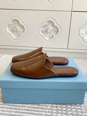 MULES IN BROWN GLOSSY SHEEPSKIN GOLD LETTERING LOGO