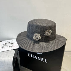 FLAT STRAW HAT BLACK FLOWER ATTACHMENT 673929