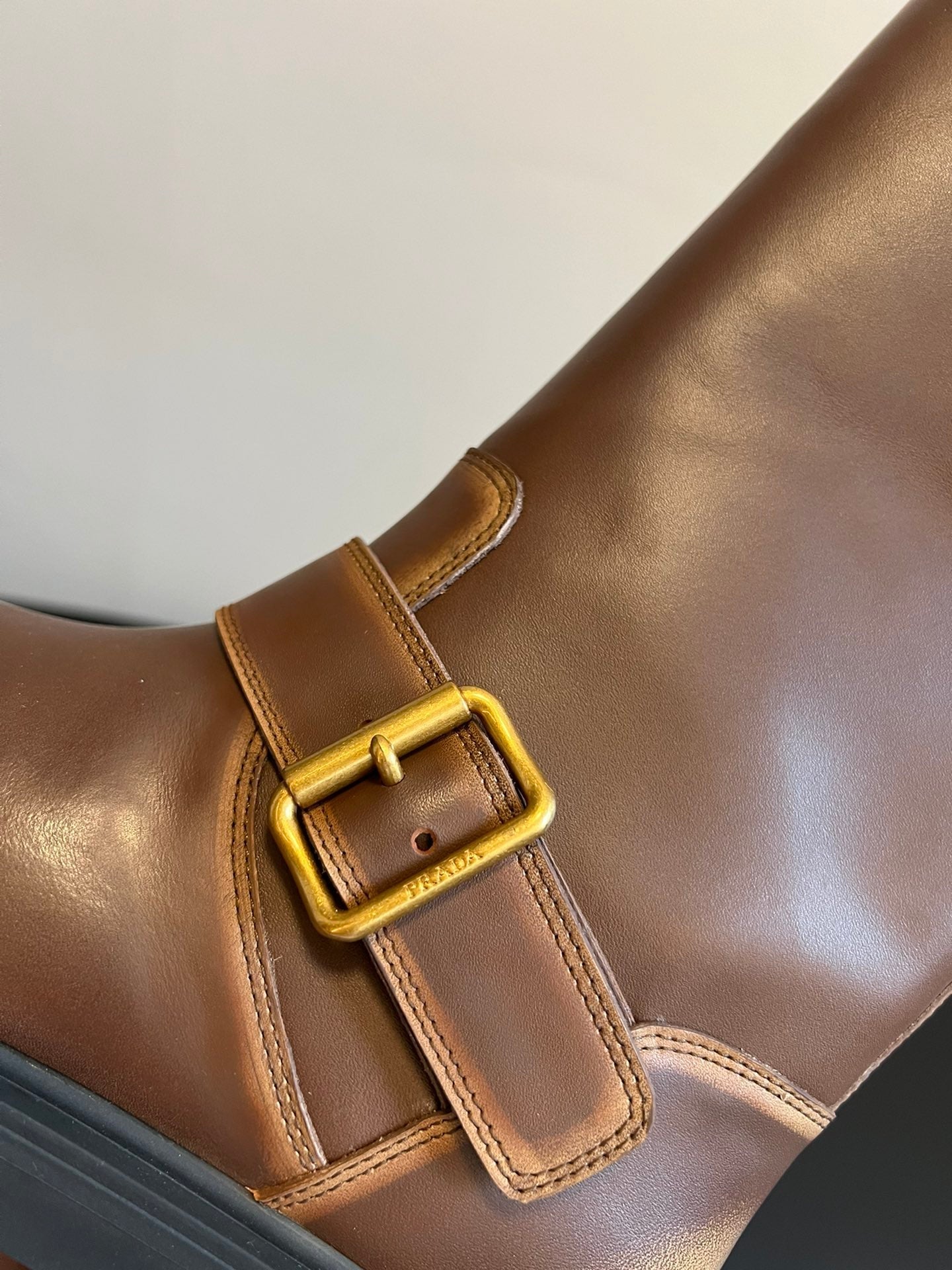 PRADA 25S HIGH-CUT PLATFORM BOOTS IN BROWN CALFSKIN WITH GOLD HARDWARE