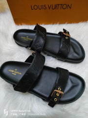 LV LOCK IT SANDALS IN BLACK EMBOSSED CALFSKIN