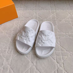 LV EMBOSSED POOL PILLOW SANDALS IN WHITE RUBBER