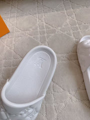 LV EMBOSSED POOL PILLOW SANDALS IN WHITE RUBBER