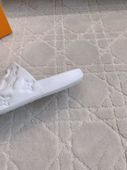 LV EMBOSSED POOL PILLOW SANDALS IN WHITE RUBBER