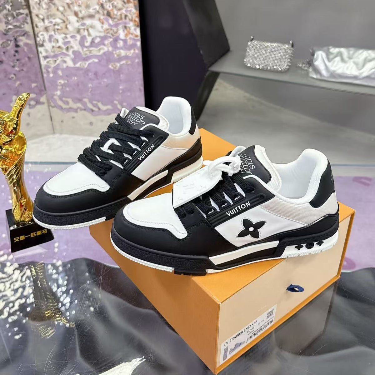 LV TRAINER SNEAKERS IN BLACK AND WHITE CALFSKIN